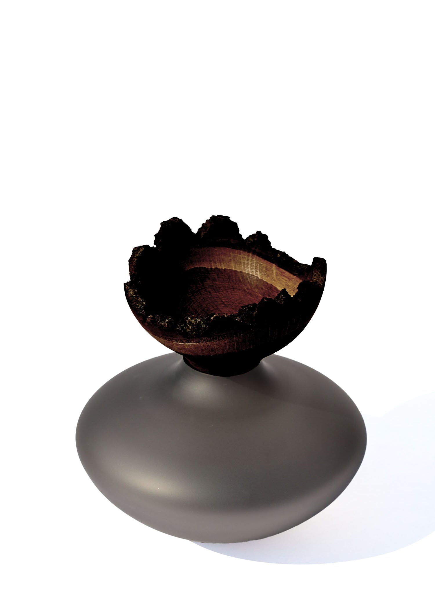 Bloom Stacking Vessel in Smoke Satin detail, showcasing a smooth, sophisticated design with a smoky finish and elegant stacking form.