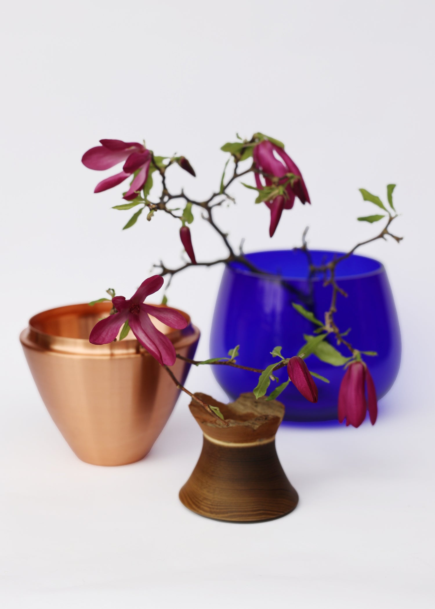 India I Stacking Vessel in Ultramarine & Copper Unstacked with Flowers, offering a rich, deep blue tone complemented by copper details for an elegant and luxurious look.