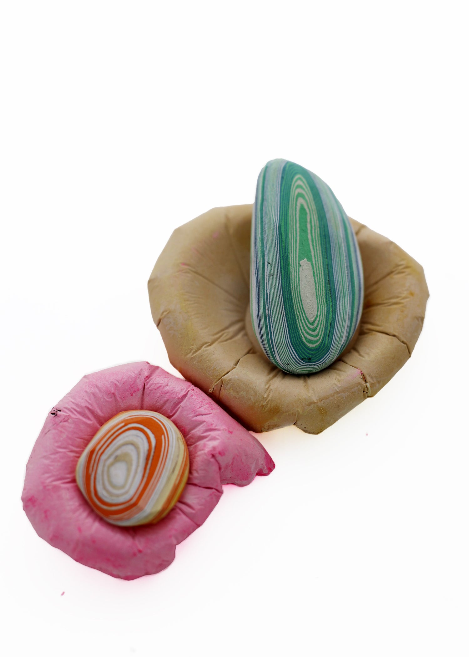 Paper Pebble in Pink & Ochre from above, featuring a unique blend of warm pink and ochre tones for a vibrant and artistic accent.