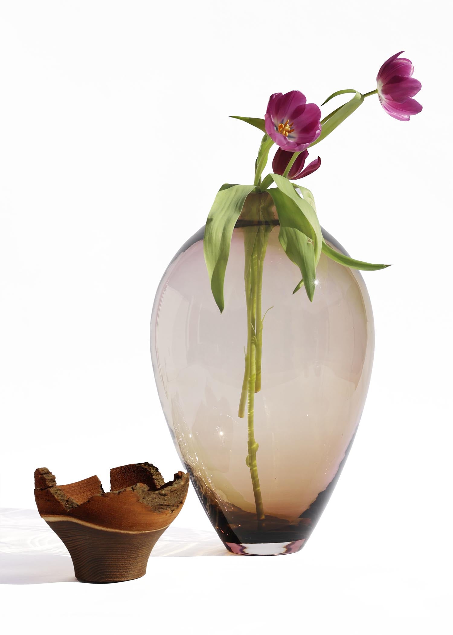 Stacking Vessel Splash in SECOND edition unstacked with flower, featuring an artistic and dynamic design that adds energy and modern flair to any space.