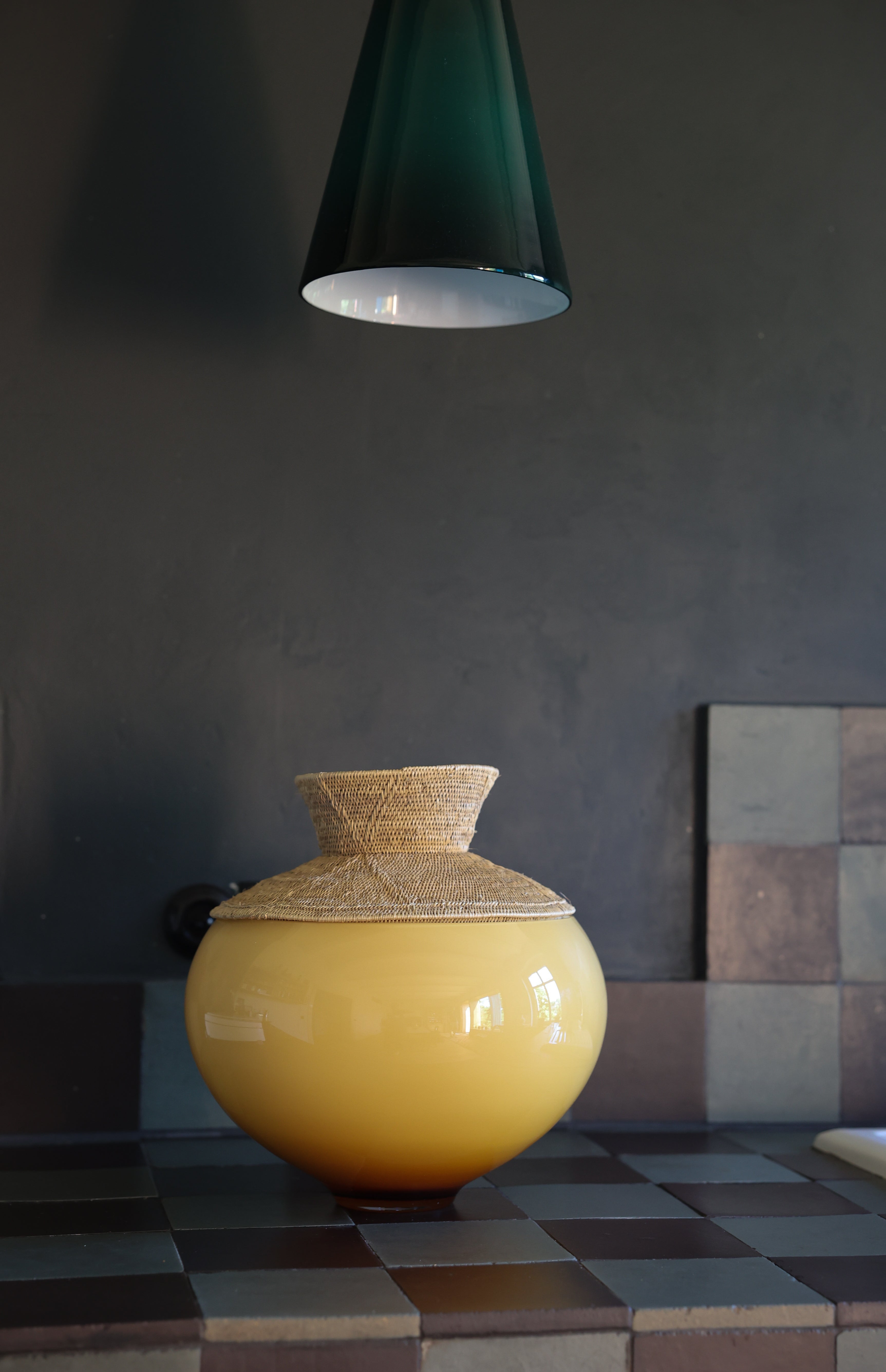 Zambia Large Stacking Vessel in kitchen, a meticulously crafted glass and woven Mekenge piece blending tradition with contemporary design.