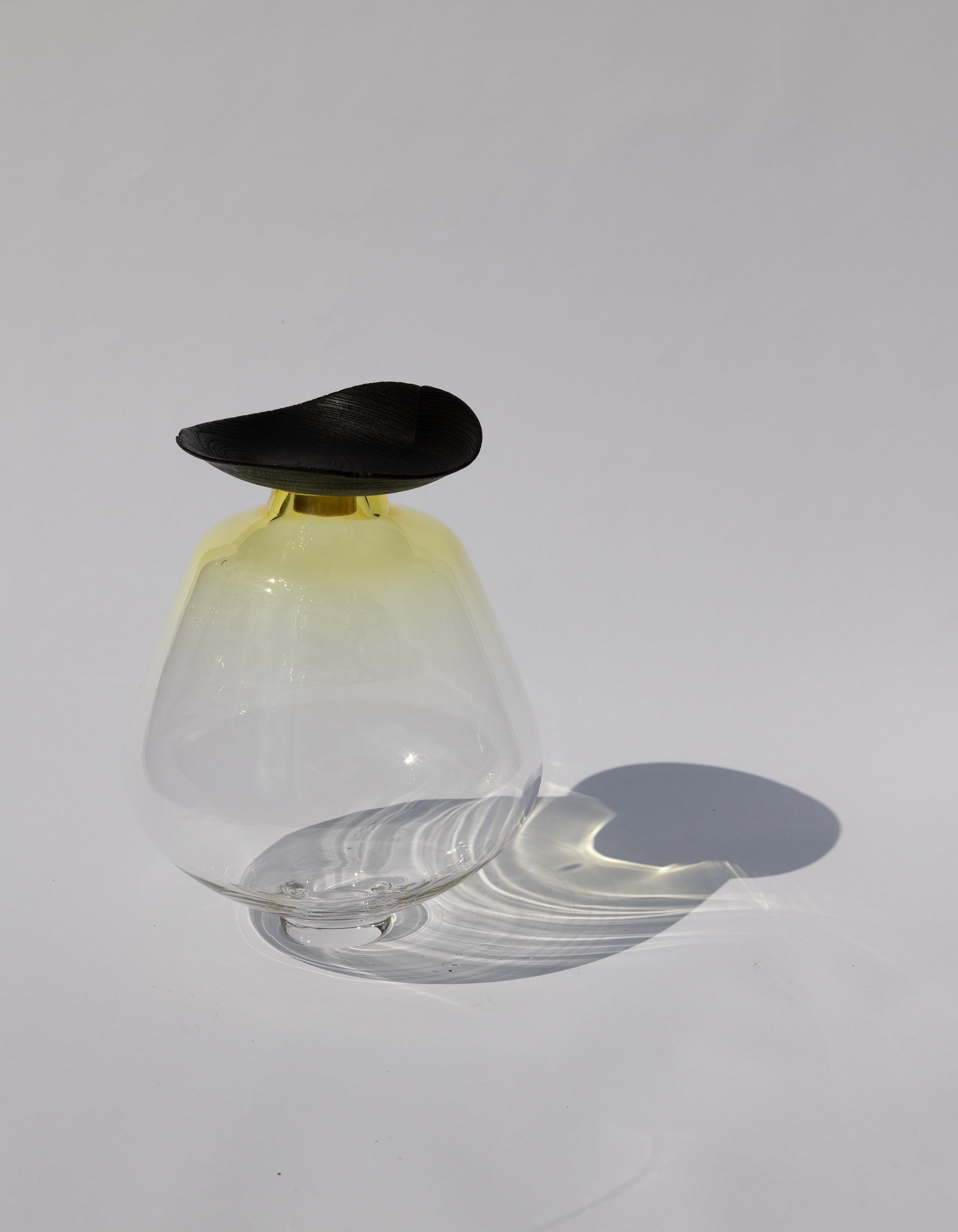 Fukui Stacking Vessel in Lemon, a vibrant yellow glass piece with elegant stacked design.