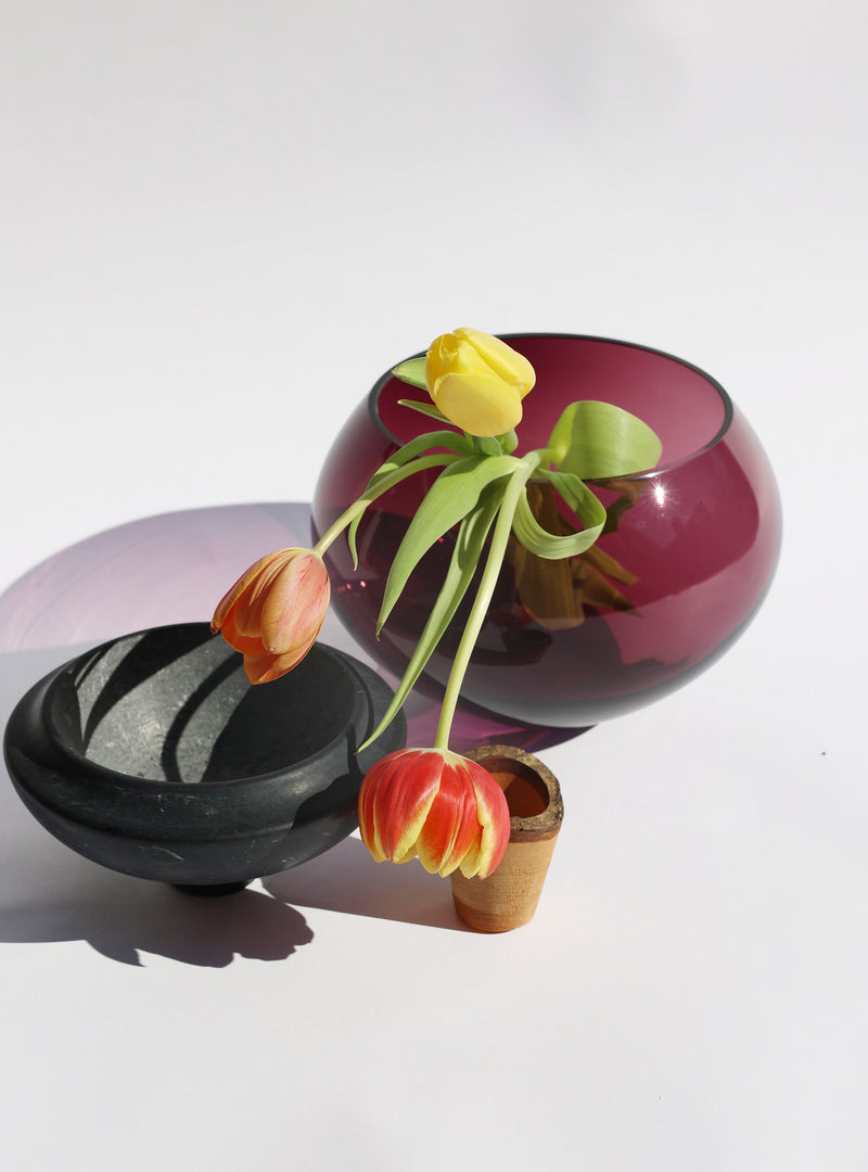 Istanbul Stacking Vessel in purple and black marble unstacked with flowers, offering a luxurious and striking design with sophisticated contrast.