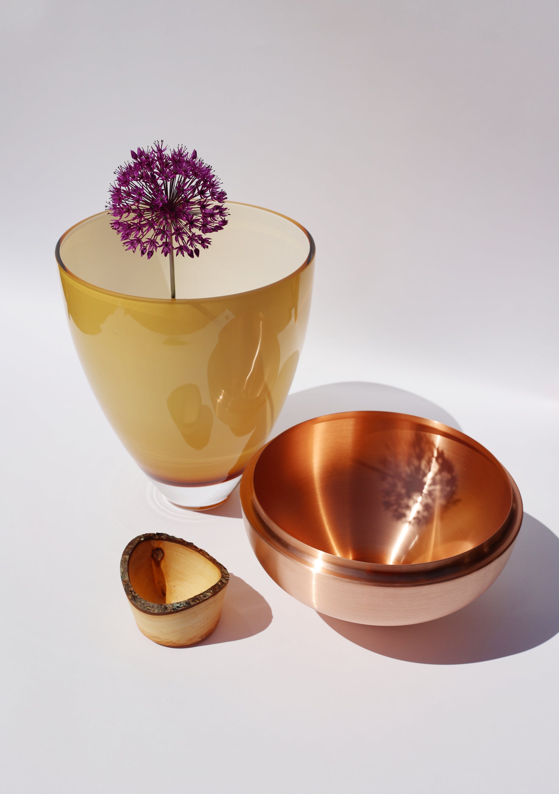 Nani Stacking Vessel in Caramel & Copper Unstacked with Flower, featuring a rich caramel hue paired with shiny copper accents for a stylish and contemporary look.
