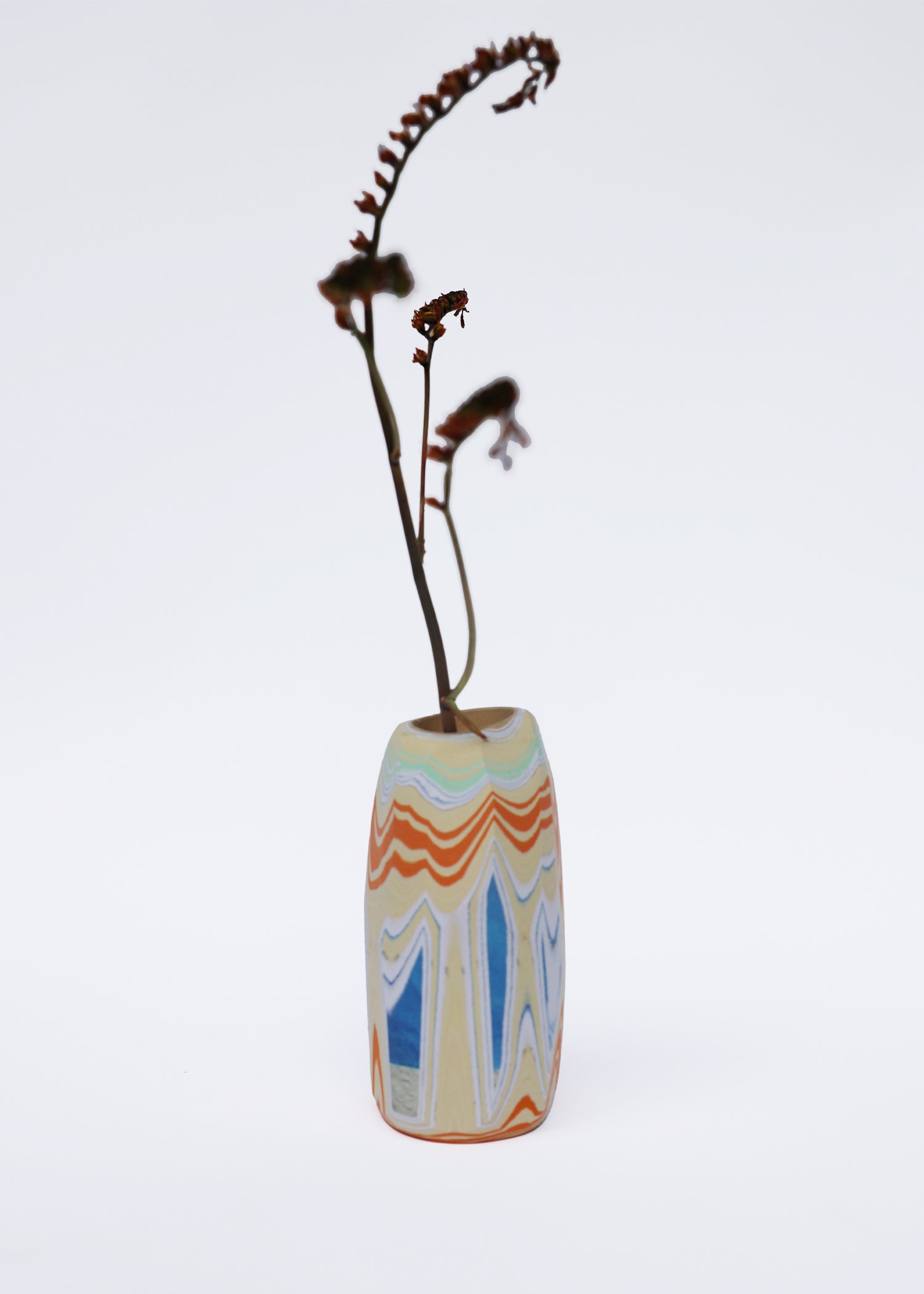 Paper Pebble Vase in Sand & Blue with flower, offering a balanced mix of natural sand tones with a pop of calming blue, perfect for modern and serene spaces.