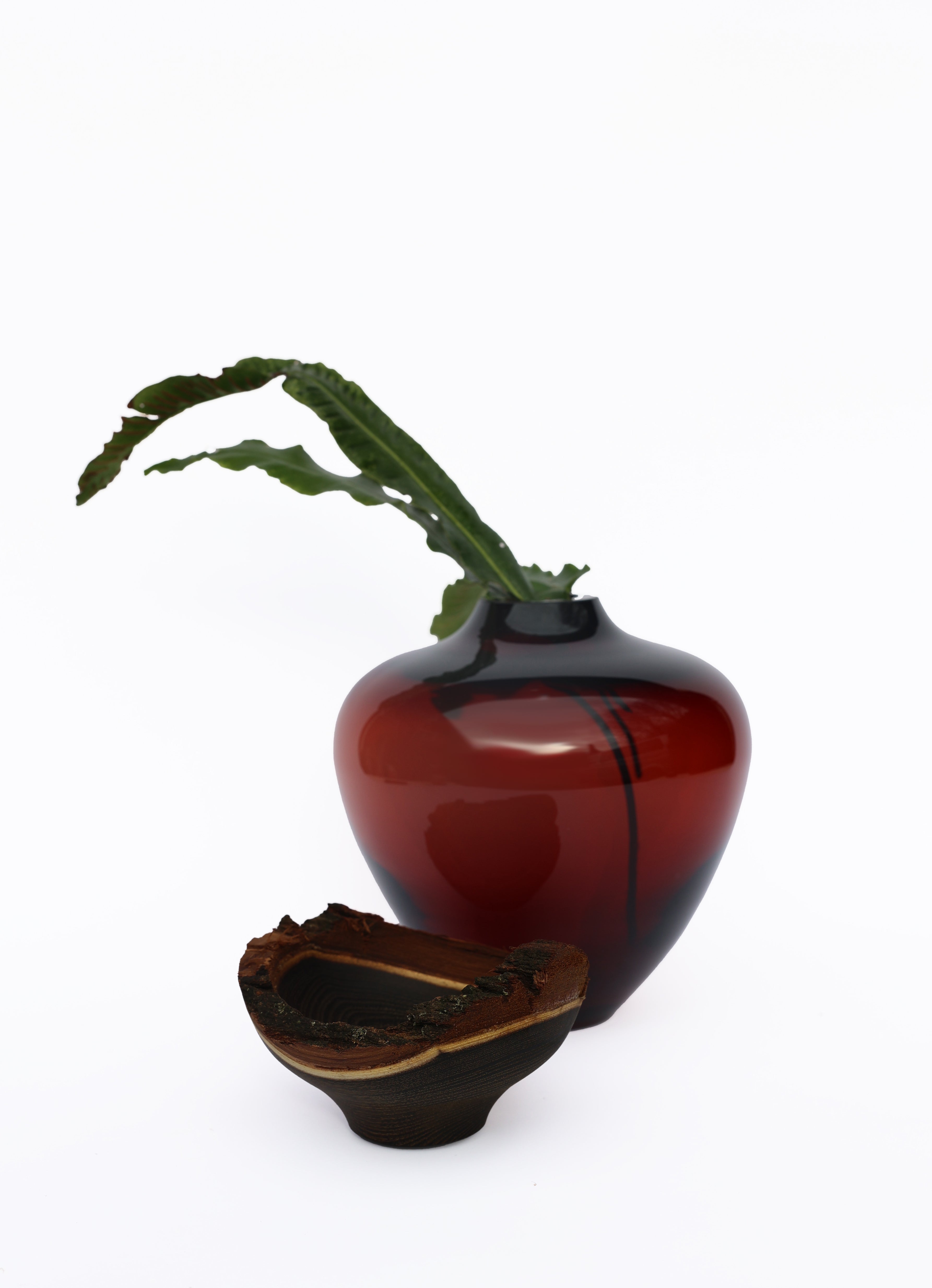 Stacking Vessel Baby Bloom in SECOND edition unstacked with leaf, showcasing a unique design with delicate, sculptural details, perfect for adding charm and sophistication to your decor.